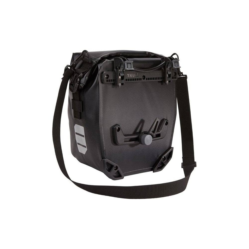 Pair of Thule Shield waterproof touring and commuter bike panniers with reflective panels for secure bike cargo storage.