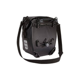 Pair of Thule Shield waterproof touring and commuter bike panniers with reflective panels for secure bike cargo storage.