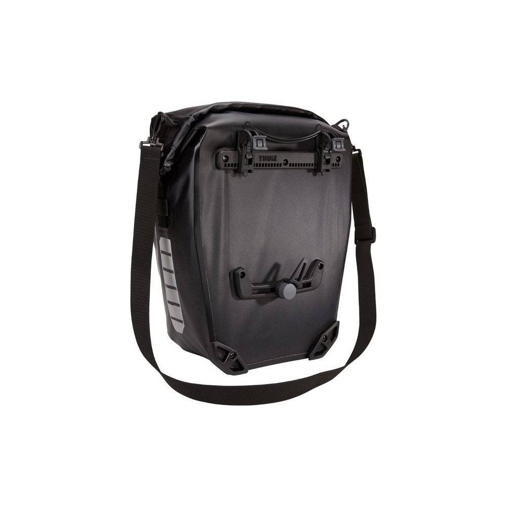Pair of Thule Shield waterproof bike panniers with reflective panels, designed for touring and commuter cycling accessories.