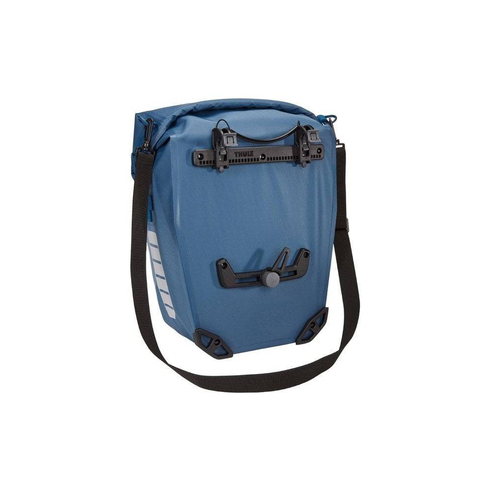 Pair of Thule Shield waterproof bike panniers with reflective panels, designed for touring and commuter cycling accessories.