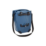 Pair of Thule Shield waterproof bike panniers with reflective panels, designed for touring and commuter cycling accessories.