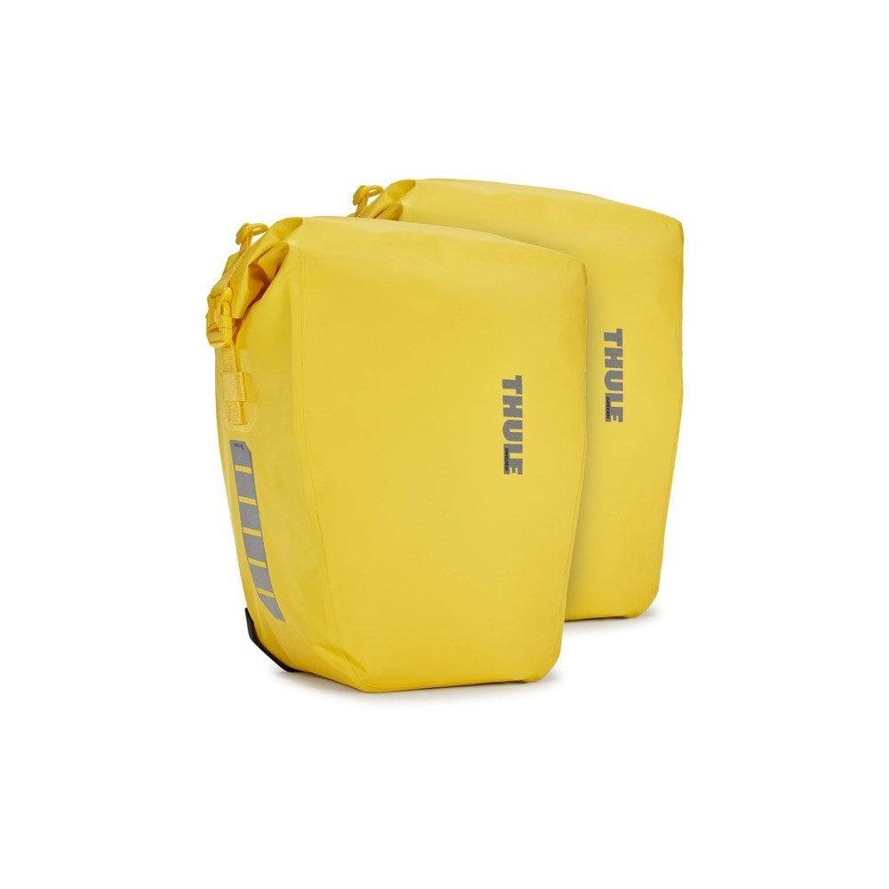 Pair of Thule Shield waterproof bike panniers with reflective panels for touring and commuting, mounted on a bike.