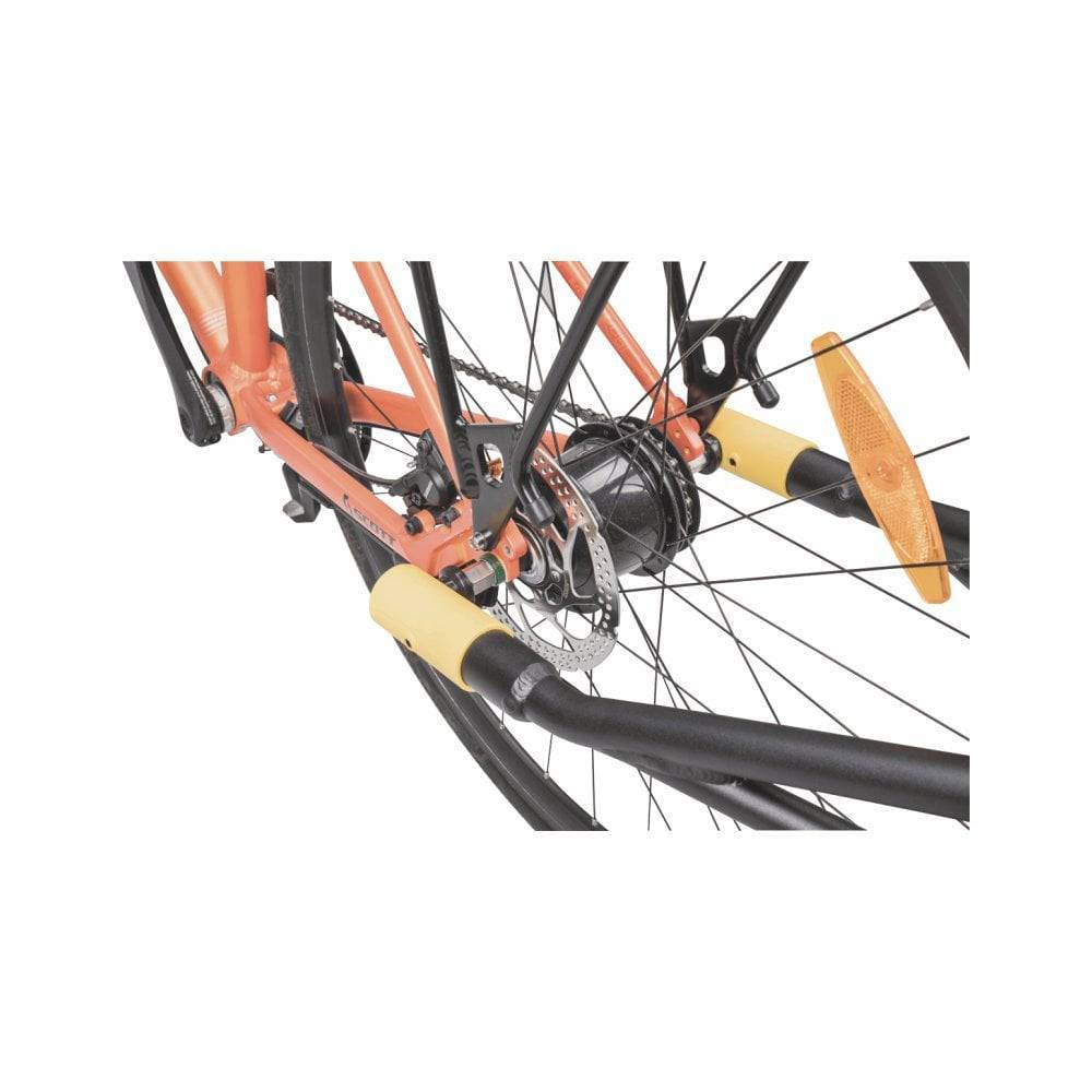Topeak Journey Trailer attached to a bicycle with waterproof drybag and SlideLock, designed for 26-inch to 700c bikes.