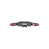 Thule Epos 3-bike towball carrier with 13-pin connector, designed for secure transport of bicycles on vehicle hitch.