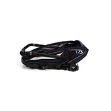 Hamax Breeze child bike trailer with stroller wheel and safety features, showing the trailer's compact, secure design and safety harness.