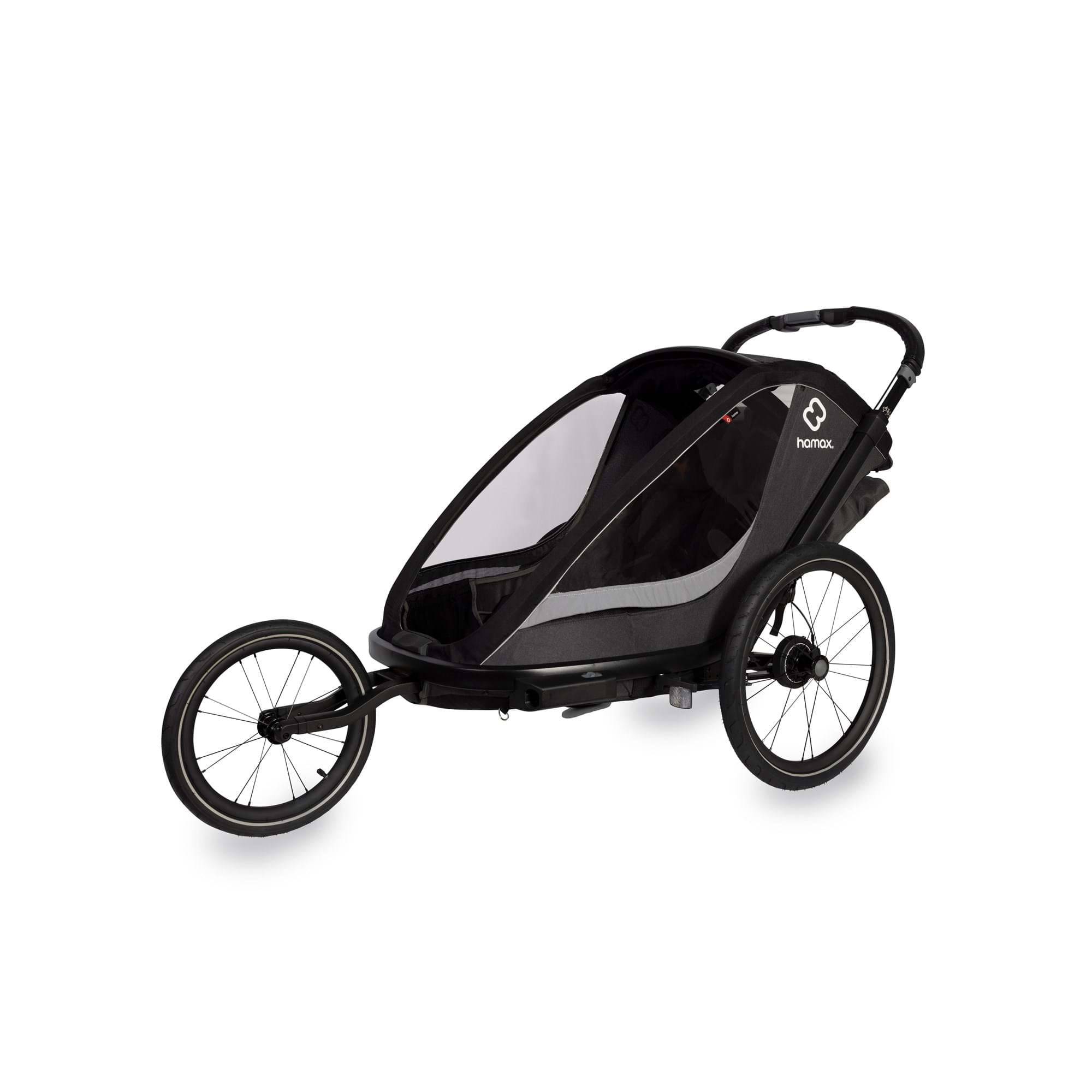 Hamax Cocoon Twin child bike trailer with convertible stroller and jogger features, including a brake system for safety.