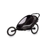Hamax Cocoon Twin child bike trailer with convertible stroller and jogger features, including a brake system for safety.