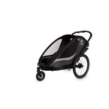 Hamax Cocoon Twin child bike trailer and stroller with brake, featuring convertible design and safety features for kids.