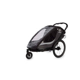Hamax Cocoon Twin child bike trailer and stroller with braking system, shown with seats and convertible design for kids' outdoor activities.