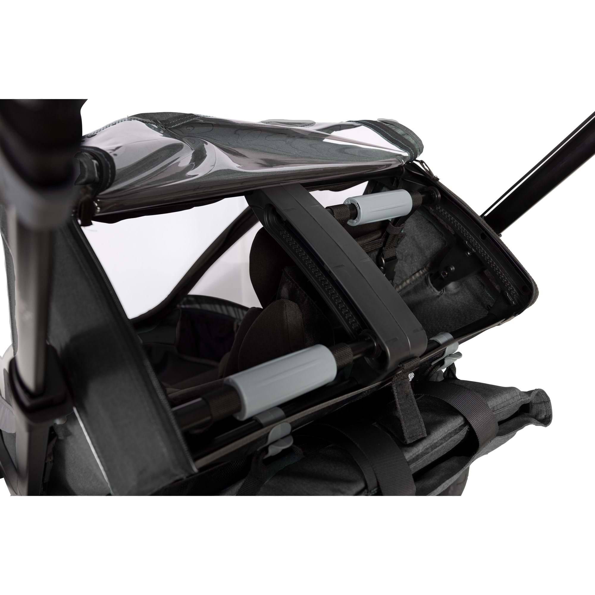 Hamax Cocoon Twin child bike trailer and stroller with brake, featuring a convertible design for biking, strolling, and jogging.