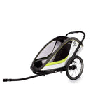 Hamax Breeze Twin Child Bike Trailer with stroller conversion and safety features, showing the sturdy frame and seating area.