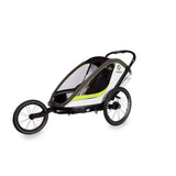 Hamax Breeze twin child bike trailer with stroller conversion, safety features, and durable frame for family cycling adventures.