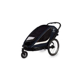 Hamax Breeze twin child bike trailer with stroller conversion, safety features, and durable frame for outdoor family rides.