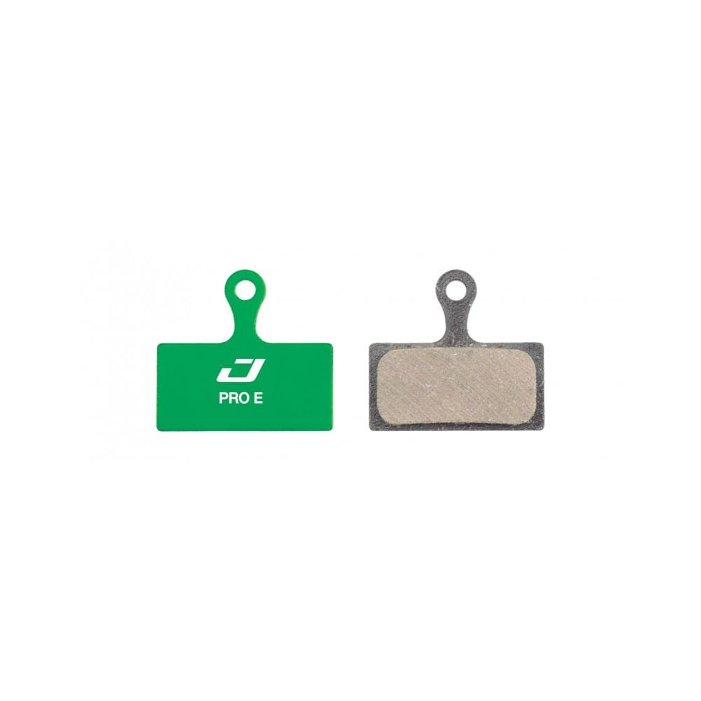 Jagwire Pro E-Bike Disc Brake Pads for Shimano and RideRever Cargo-D Green, shown in a close-up image of the brake components.