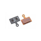 Jagwire Pro Extreme Sintered Disc Brake Pads for Shimano and Riderever bike brake systems, mounted on bike wheel.