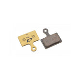 Jagwire Pro semi-metallic disc brake pads for Shimano and RideRever road bikes, showing the brake pad components and packaging.