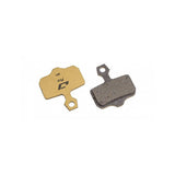 Jagwire Pro semi-metallic disc brake pads for SRAM AXS Road and Avid Gold Pro bikes, shown in close-up view.