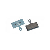 Jagwire Sport Organic disc brake pads for Shimano and RideRever Cargo-D bikes, featuring blue friction material and metal backing plate.