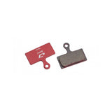 Jagwire Sport Semi-Metallic Disc Brake Pads for Shimano and RideRever systems, shown with metal backing and brake surface.