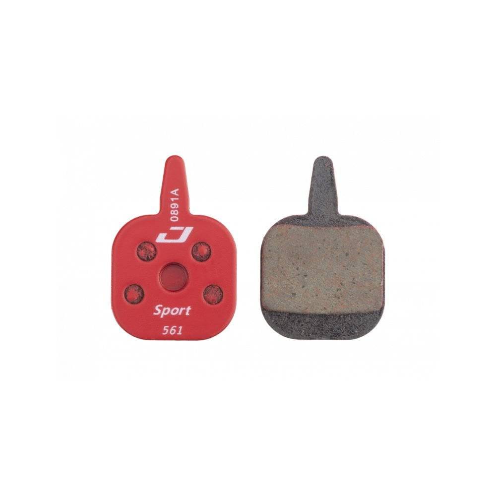 Jagwire Sport semi-metallic disc brake pads for Tektro IO brakes, showing the brake pads with metal backing and friction material.