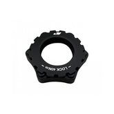 Jagwire 6-bolt to center lock disc rotor adapter for bike brakes, showing the metallic adapter component with bolt holes.