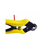 Jagwire Pro Housing Cutter Yellow with built-in crimper and awl for cutting and installing shift and brake cables in a workshop setting.