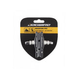 Jagwire Mountain Pro brake pads for linear pull and cantilever MTB brakes, showing close-up of the components and brake pad surface.