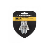 Jagwire Road Sport S brake pads for SRAM, Shimano, and Campagnolo caliper brakes, shown on a bicycle brake system.