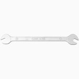 UNIOR double-ended pedal wrench with 15x15mm ends, durable bike tool for pedal installation and removal in a workshop setting.
