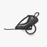 Hamax Cocoon child bike trailer, multi-use stroller and jogger accessory with a compact design and safety features for kids.