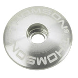 Black Thomson 1 1/8 stem cap spare part for bicycle stems, showing the component and branding on the product.