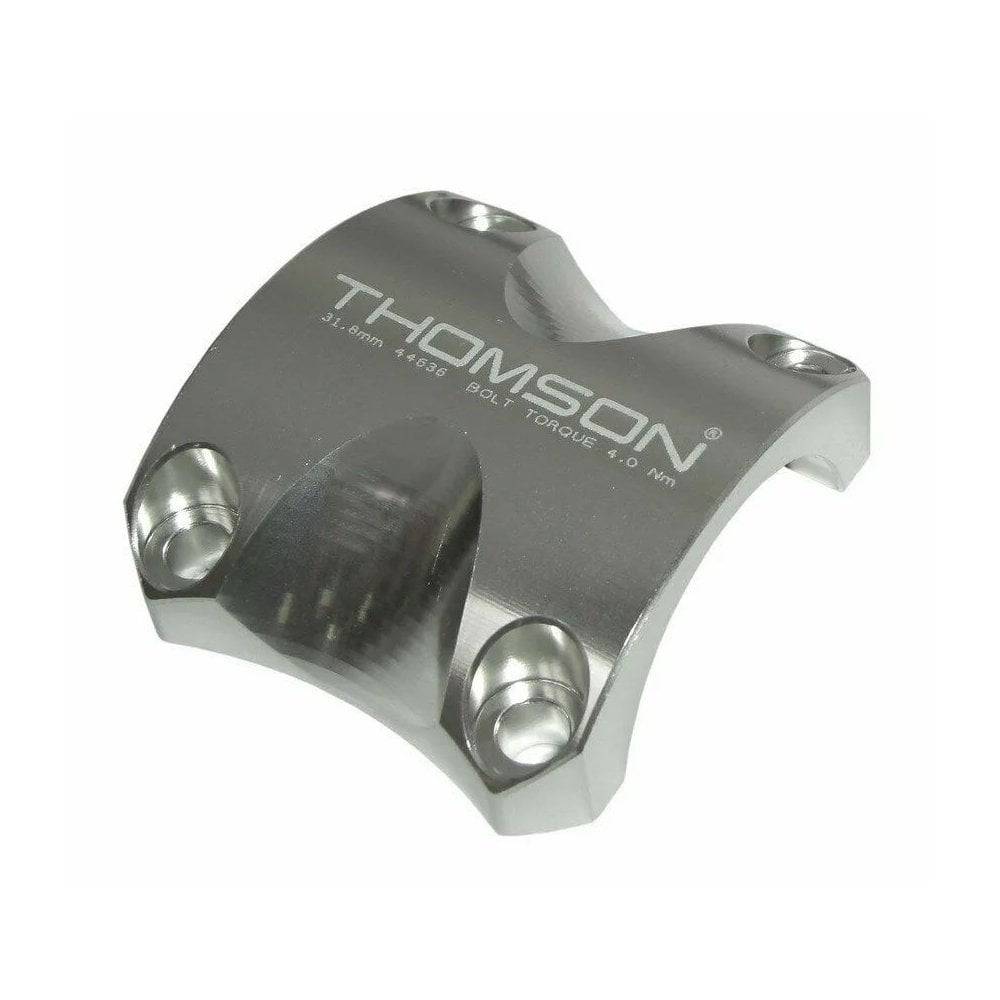 Thomson black replacement clamp for X4 stem, 31.8mm, showing the genuine spare part in close-up.