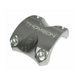 Thomson black replacement clamp for X4 stem, 31.8mm, showing the genuine spare part in close-up.