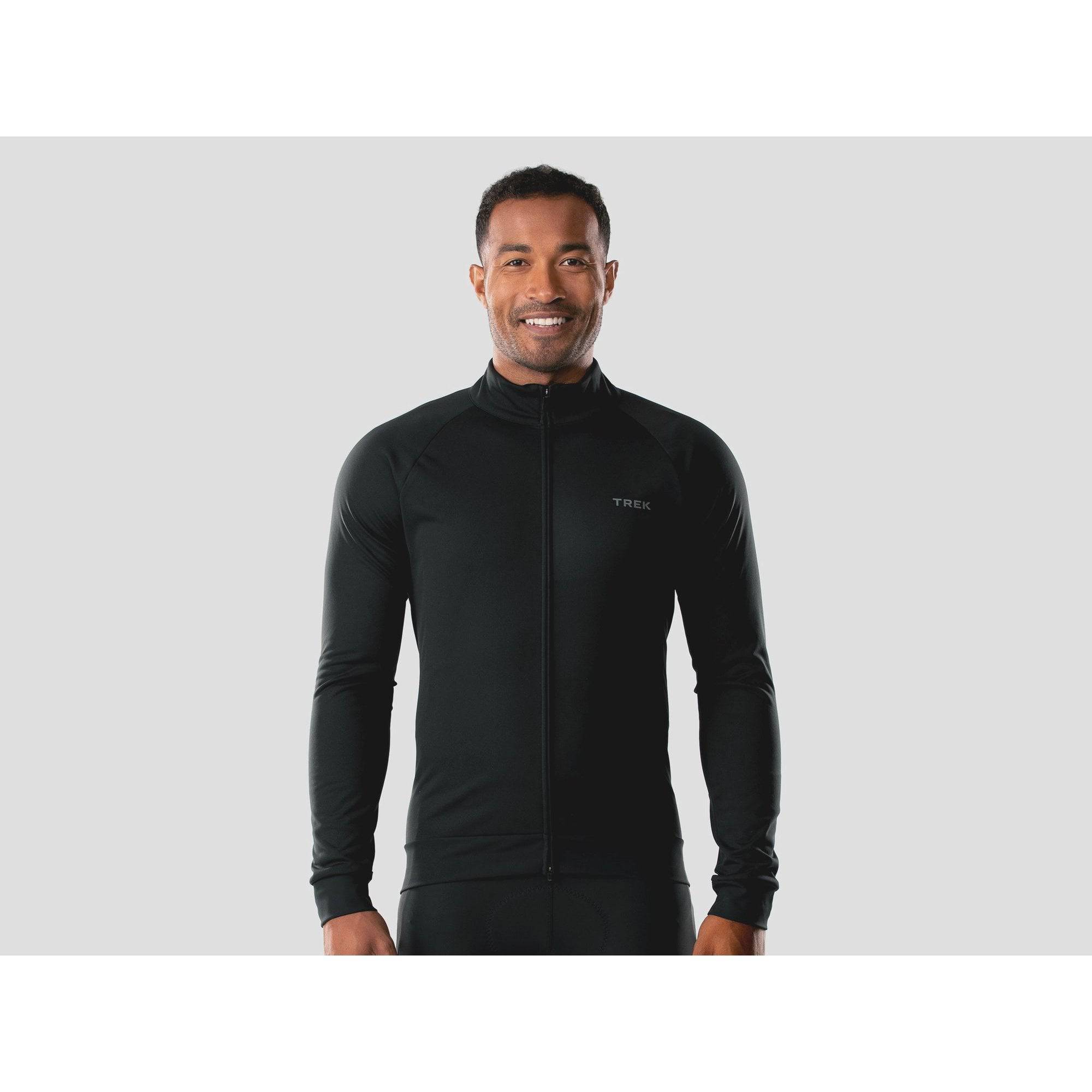 Trek Circuit softshell cycling jacket with windproof, waterproof fabric and fleece lining for outdoor biking comfort.