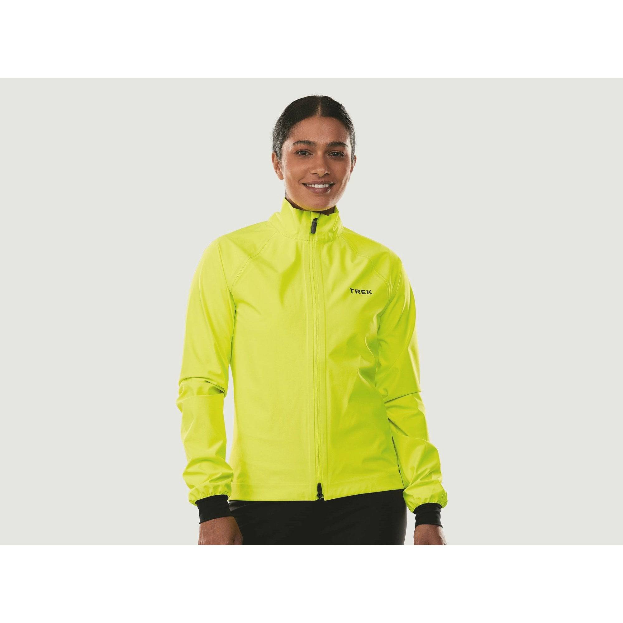Trek Circuit Women's waterproof rain cycling jacket, lightweight and packable, shown in a vibrant color with reflective details.