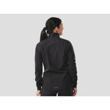 Trek Circuit Women's waterproof rain cycling jacket, lightweight and packable, shown in a vibrant color on a model.