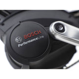 Electra Townie Commute Go! 5i EQ step-thru e-hybrid bike with Bosch motor and integrated racks, suitable for city commuting.