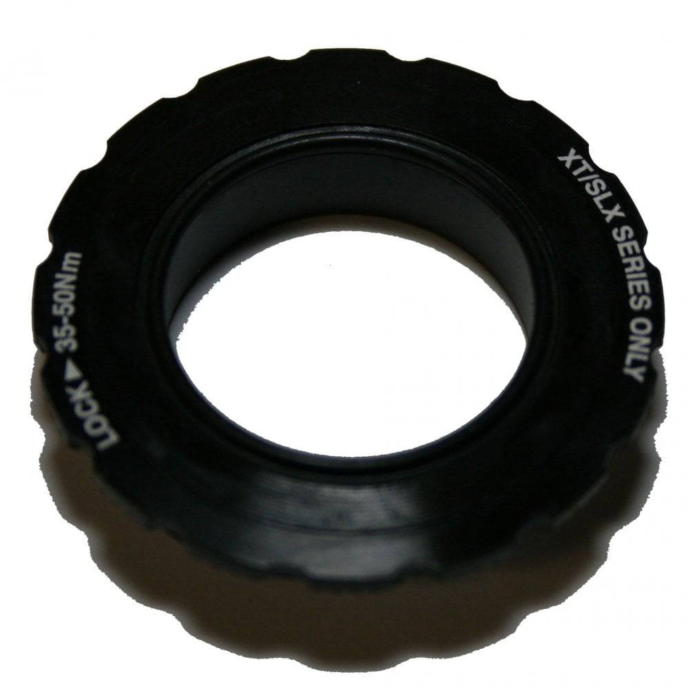 Shimano FC-M8100 lock ring and washer replacement components for bike cranksets, featuring durable metal construction.