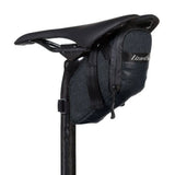Lizard Skins Cache Saddle Bag in jet black, compact cycling accessory mounted on bike saddle for storage.