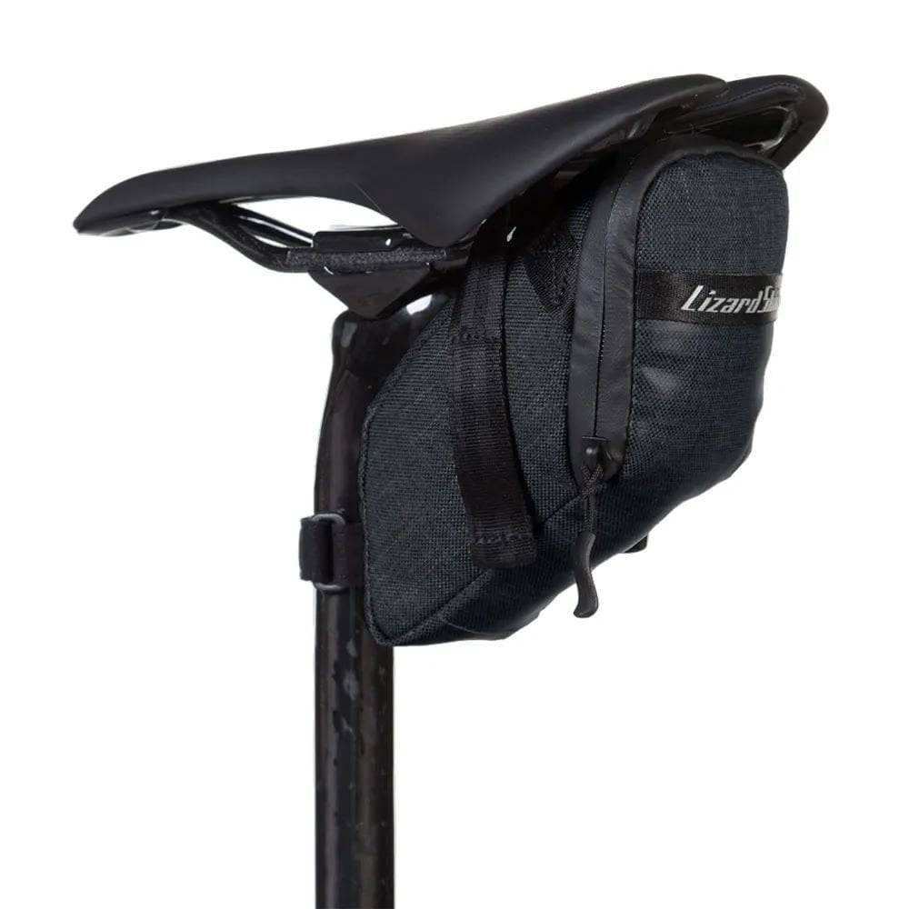 Lizard Skins Super Cache saddle bag in jet black, compact bike storage accessory with waterproof zipper for cycling essentials.