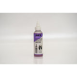 Joe's No Flats Suspension & Dropper Post Smoother Lube for bike shocks, 125ml, in a workshop setting, with lubricant bottle visible.