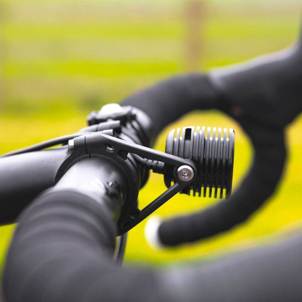 Exposure Fuse front LED bike light for e-bike commuters, 1000 lumens, black, with sleek design and mounting hardware.
