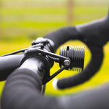 Exposure Fuse front LED bike light for e-bike commuters, 1000 lumens, black, with sleek design and mounting hardware.