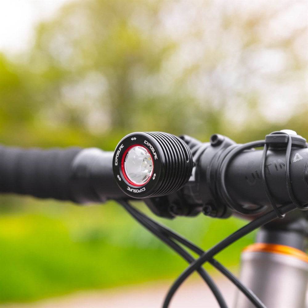 Black Exposure Fuse front light for e-bike, 1000 lumen LED, compact design, ideal for commuter electric bicycles.