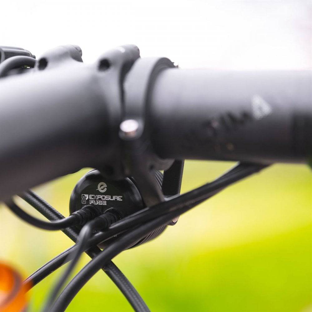 Black Exposure Fuse front LED light for e-bike, 1000 lumens, compact bike commuter accessory with bright illumination.