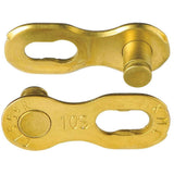 KMC Missinglink 10R Ti-Ni gold reusable chain link for 10-speed bike chains, showing the gold-colored component and packaging.