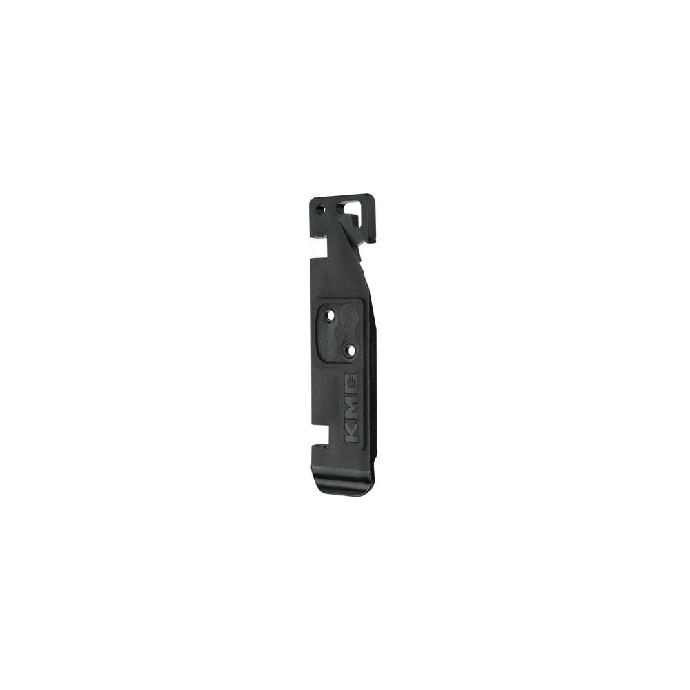 KMC Chain Aid bike workshop tool with chain latch, MissingLink holder, valve core remover, and tyre lever on a workbench.