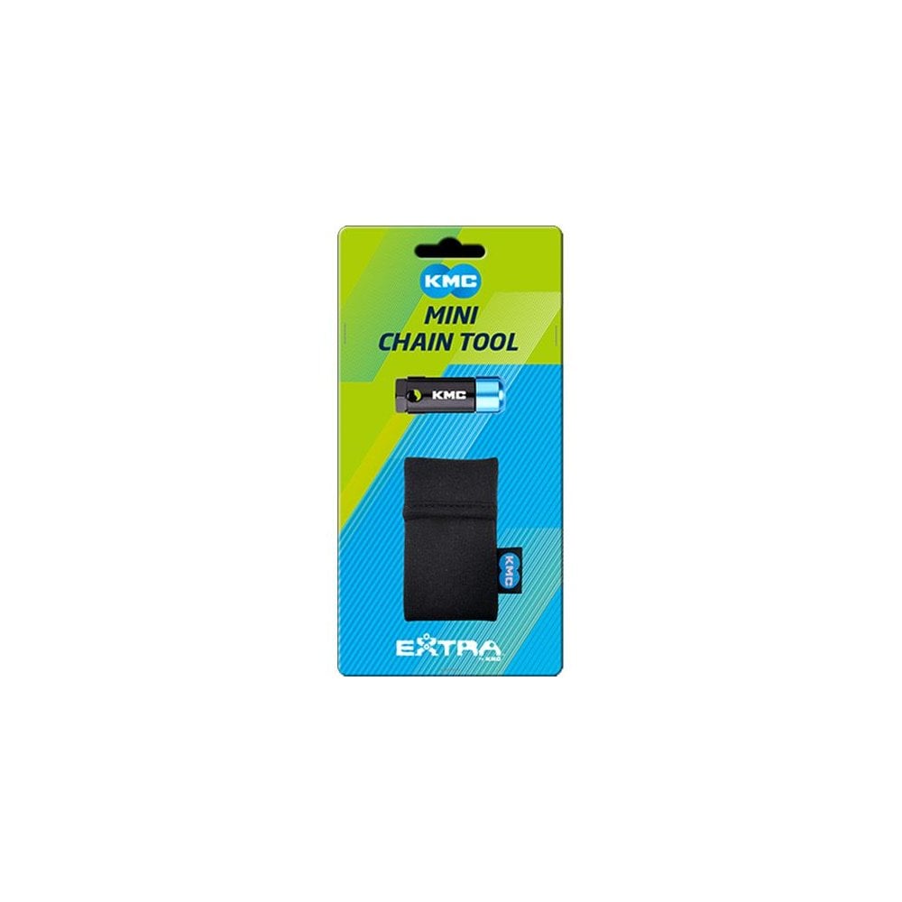 KMC mini bicycle chain tool for up to 12-speed chains with storage pouch, used in bike workshop for chain maintenance.