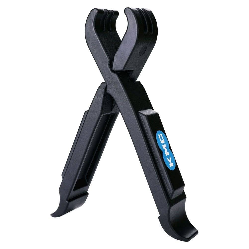 KMC workshop missing link tyre levers pair with chain link remover and valve deflator for bike maintenance and tire repair.