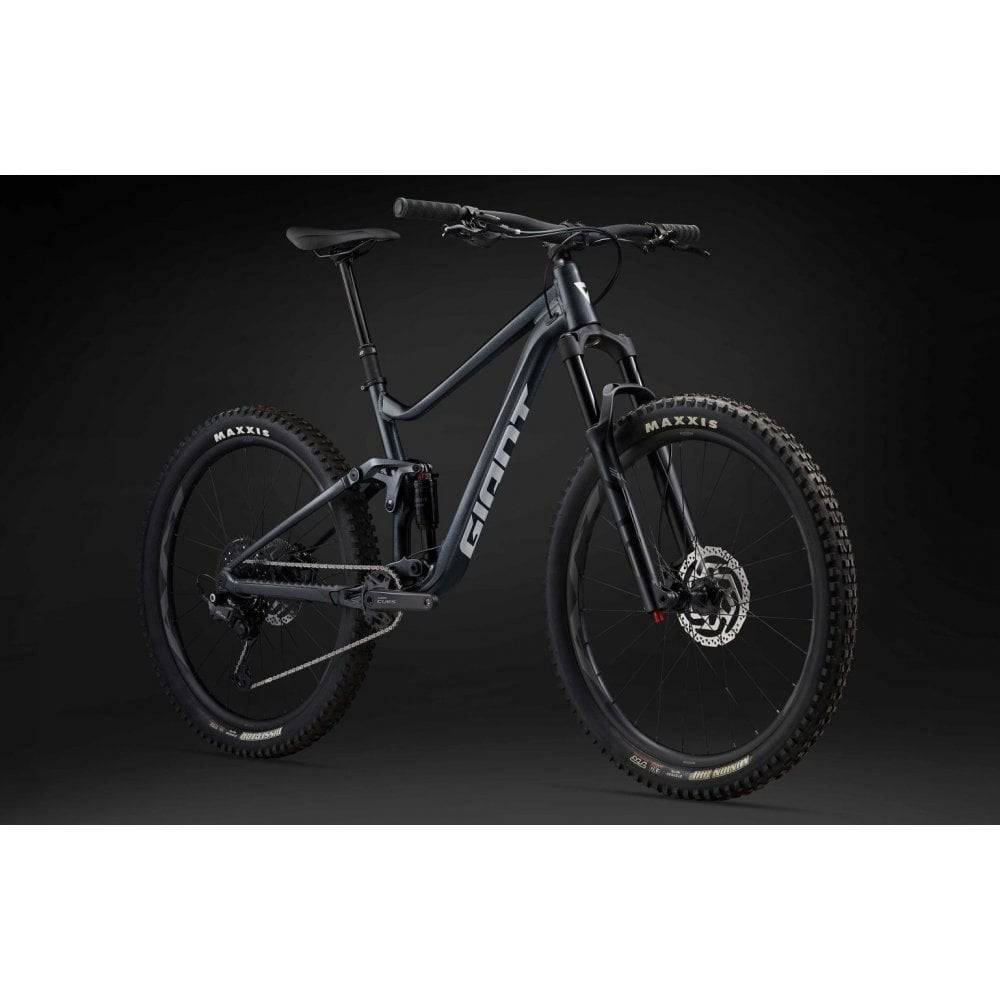 Giant Stance mountain bike with 125mm rear FlexPoint suspension and 140mm front fork, ready for trail riding.